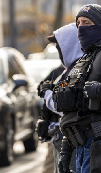 Masked, armed agents outside Ocean Seafood Depot during an immigration raid, Newark, NJ, Wednesday, Nov. 19, 2025. (Photo by Anne-Marie Caruso/New Jersey Monitor)