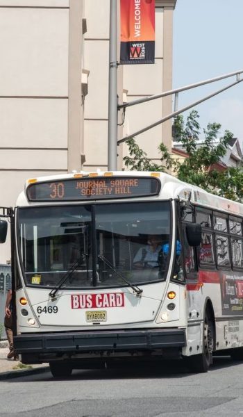 Passengers get off an A&C Bus Corp No. 30 bus on West Side Avenue in Jersey City on Tuesday, July 25, 2023. (Reena Rose Sibayan / The Jersey Journal)