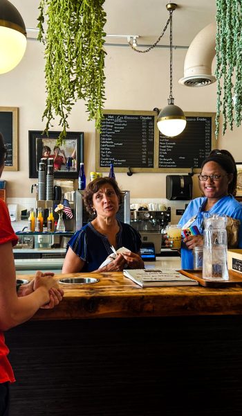 Owner of Choco O Pain, Clemence talking with customers